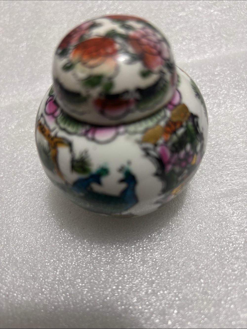 Decorative White Porcelain Ginger Jar with Floral and Peacock Motif
